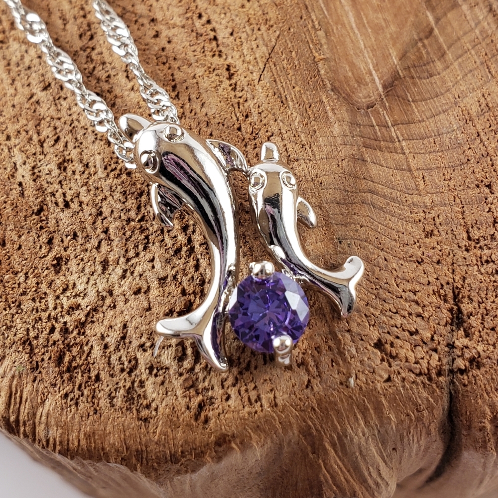 Dolphin necklace with purple stone